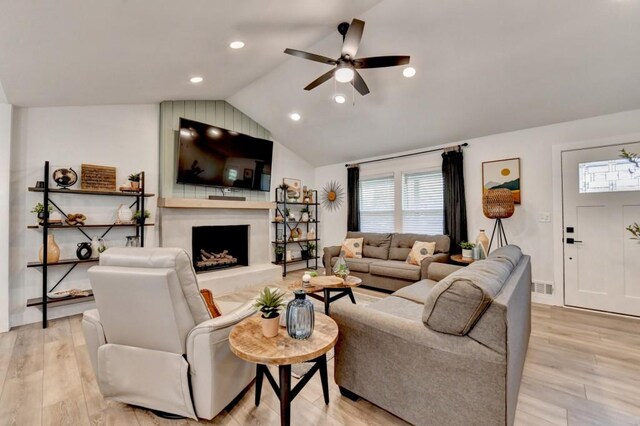5441 E Main St, Flowery Branch, GA 30542 - living room with vaulted ceiling, ceiling fan, a fireplace, light wood finished floors, and recessed lighting