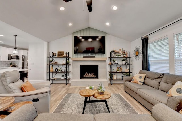 5441 E Main St, Flowery Branch, GA 30542 - living room featuring a ceiling fan, light wood-type flooring, recessed lighting, lofted ceiling, and a fireplace with raised hearth