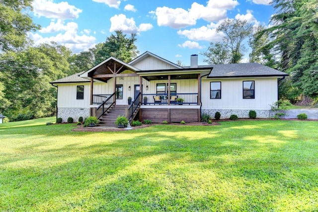 5441 E Main St, Flowery Branch, GA 30542 - view of front of house featuring a chimney, covered porch, a front lawn, board and batten siding, and roof with shingles