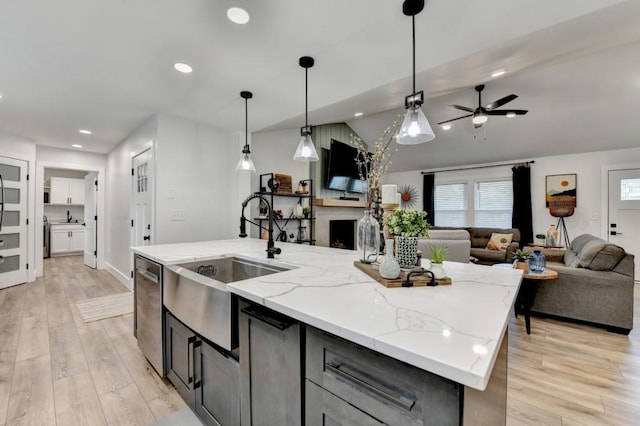 5441 E Main St, Flowery Branch, GA 30542 - kitchen featuring open floor plan, dishwasher, ceiling fan, a kitchen island with sink, and decorative light fixtures