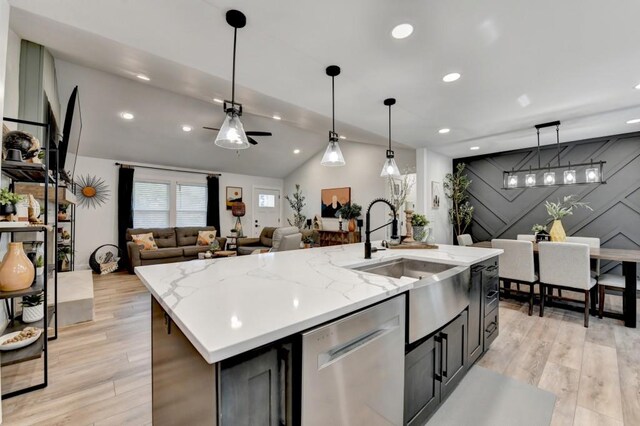 5441 E Main St, Flowery Branch, GA 30542 - kitchen featuring range with two ovens, wall chimney exhaust hood, white cabinets, light wood-type flooring, and light stone countertops