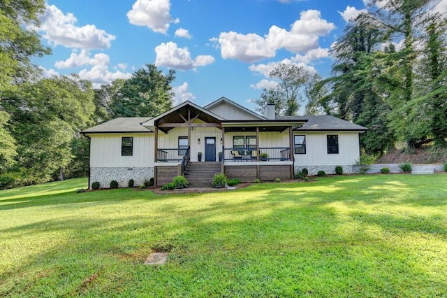 5441 E Main St, Flowery Branch, GA 30542 - view of front of home with covered porch, a front yard, and a chimney