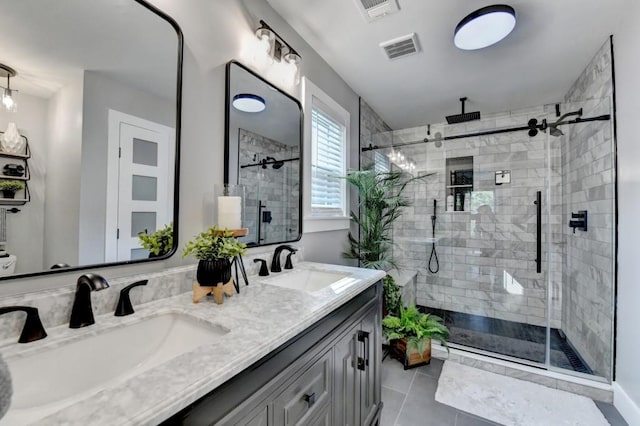 5441 E Main St, Flowery Branch, GA 30542 - full bathroom featuring a shower stall, double vanity, and tile patterned flooring