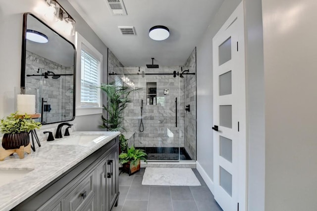 5441 E Main St, Flowery Branch, GA 30542 - bathroom with a shower stall, double vanity, and tile patterned floors