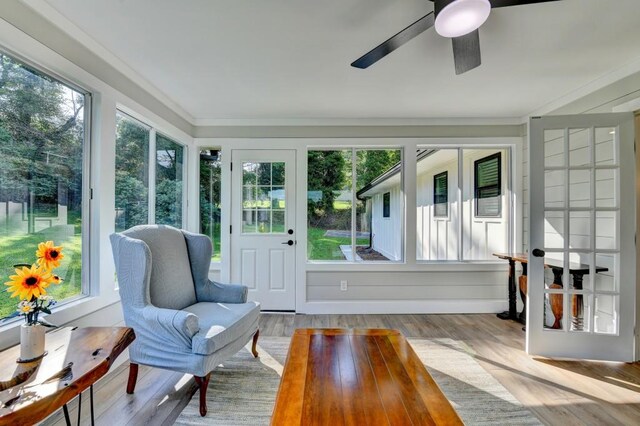 5441 E Main St, Flowery Branch, GA 30542 - sunroom / solarium featuring wood finished floors, ornamental molding, and a wooden deck