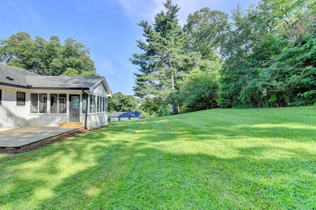 5441 E Main St, Flowery Branch, GA 30542 - view of green lawn with a patio and a sunroom