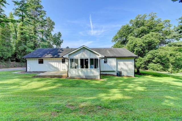 5441 E Main St, Flowery Branch, GA 30542 - back of house with a yard, a sunroom, and roof with shingles