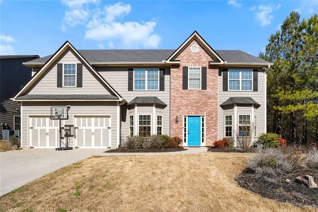 view of front of home with a front lawn, a garage, and central air condition unit