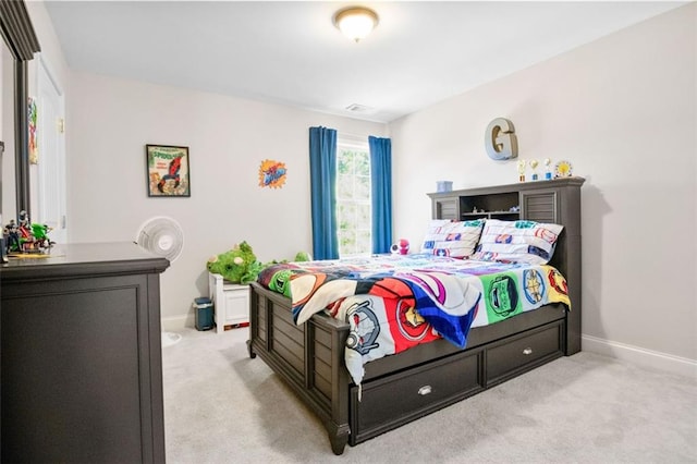 bedroom with light colored carpet