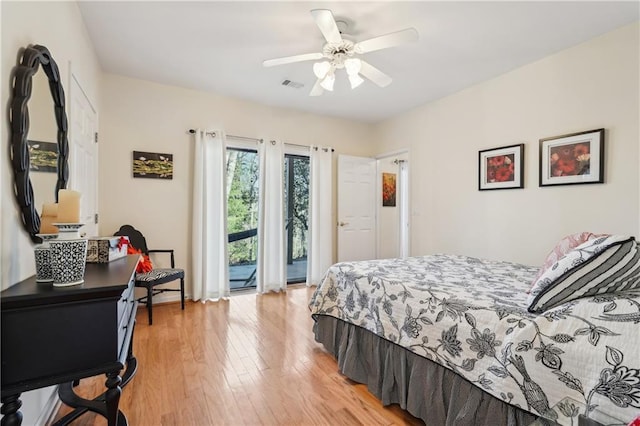 bedroom with light wood finished floors, access to outside, visible vents, and ceiling fan