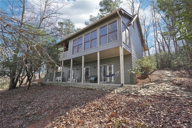 back of property featuring a porch