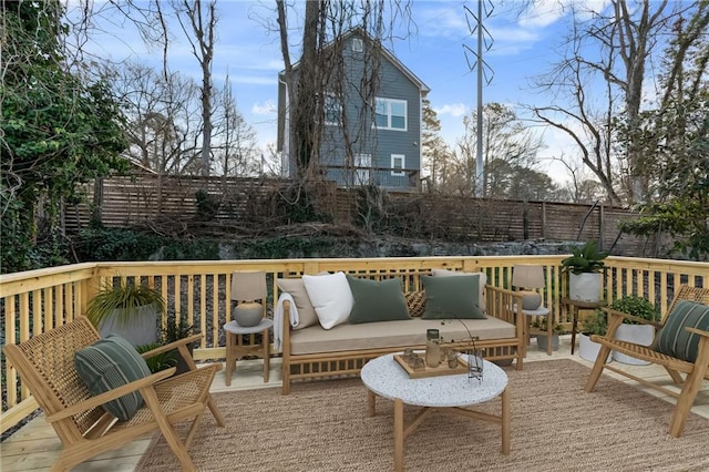 wooden deck with an outdoor living space