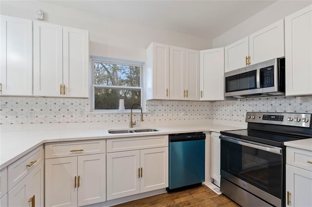 kitchen featuring white cabinetry, sink, and stainless steel appliances