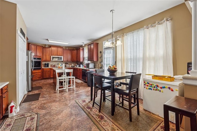 dining space featuring a chandelier