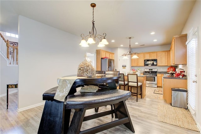 3258 Kessock Ridge Trl, Snellville, GA 30039 - dining space featuring light wood finished floors, a chandelier, and recessed lighting