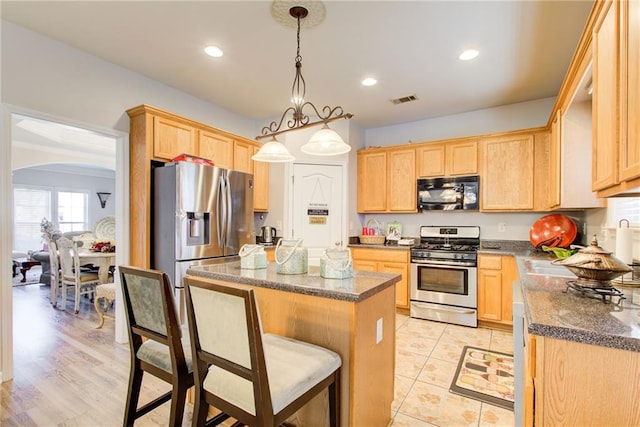 3258 Kessock Ridge Trl, Snellville, GA 30039 - kitchen with stainless steel appliances, light brown cabinets, and recessed lighting