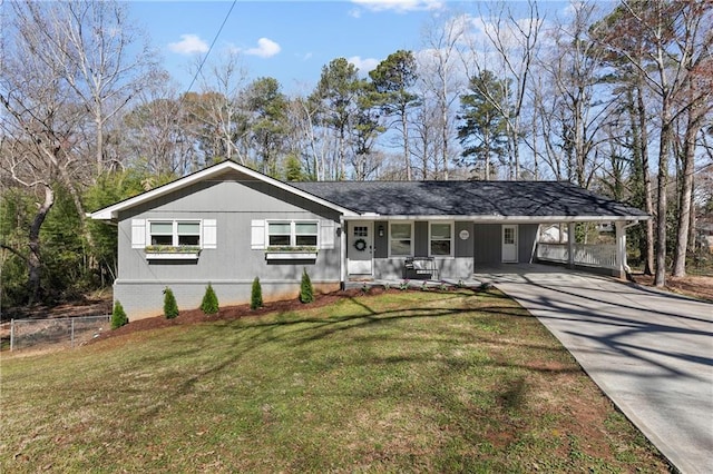 ranch-style home with a front lawn, a porch, fence, concrete driveway, and a carport