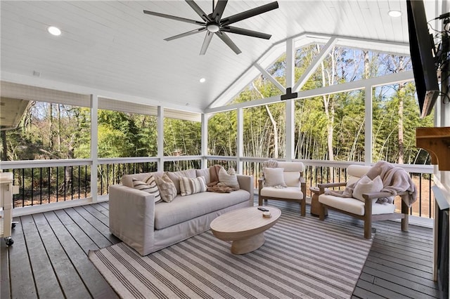 sunroom featuring a wealth of natural light, a ceiling fan, and vaulted ceiling