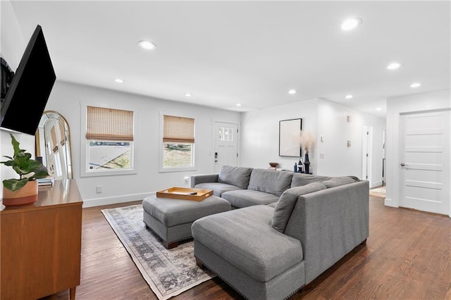 living area with recessed lighting, baseboards, and dark wood finished floors