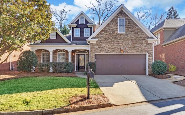 view of front of property featuring a front yard and a garage