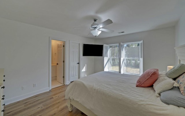 bedroom with ceiling fan, light hardwood / wood-style flooring, and ensuite bath