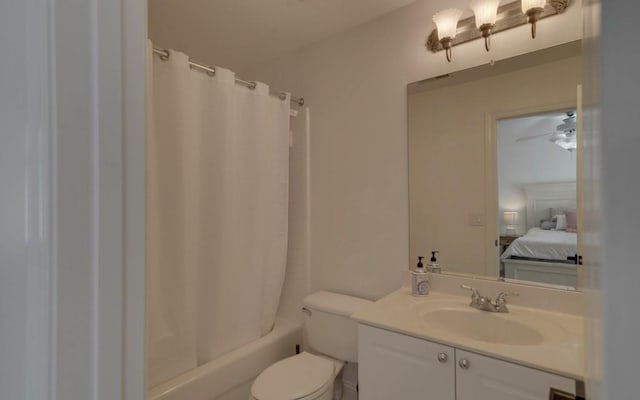 full bathroom featuring ceiling fan, toilet, vanity, and shower / bath combo with shower curtain