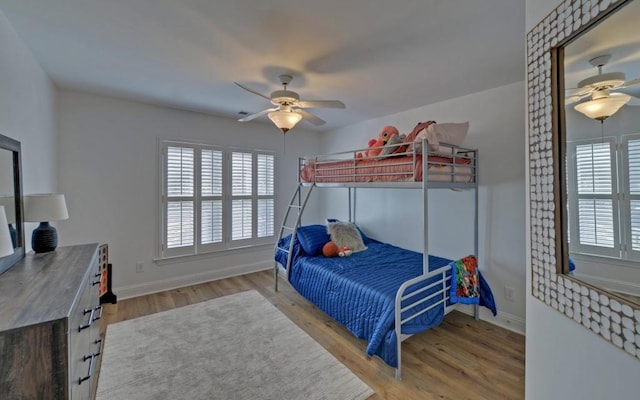 bedroom featuring ceiling fan and hardwood / wood-style flooring