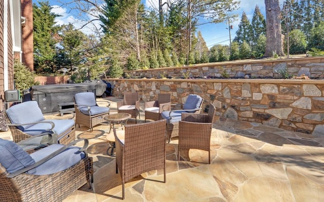 view of patio with a hot tub