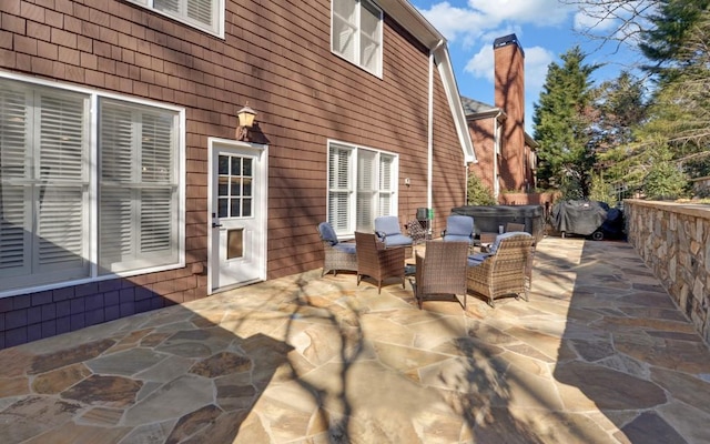 view of patio featuring a hot tub