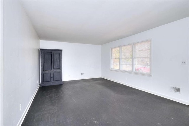 707 E Spring St E, Monroe, GA 30655 - empty room featuring baseboards