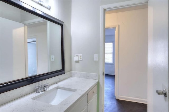 707 E Spring St E, Monroe, GA 30655 - bathroom featuring wood finished floors and vanity