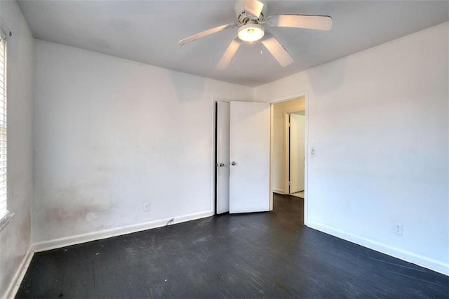707 E Spring St E, Monroe, GA 30655 - empty room with wood finished floors, baseboards, and a ceiling fan