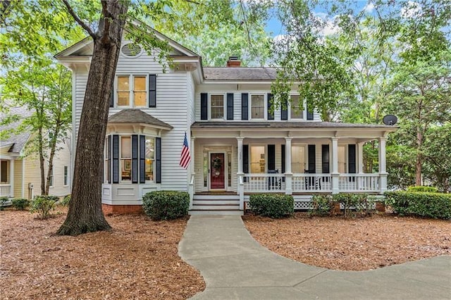 137 Oakton S, Eatonton, GA 31024 - view of front facade with a porch and a chimney