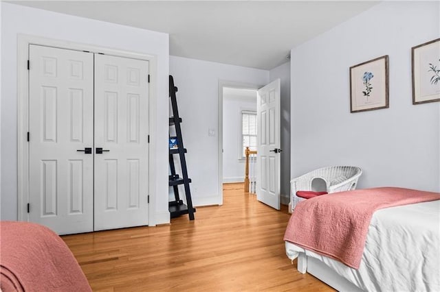 137 Oakton S, Eatonton, GA 31024 - bedroom with light wood-style flooring, baseboards, and a closet