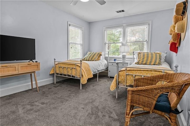 137 Oakton S, Eatonton, GA 31024 - carpeted bedroom with baseboards, a ceiling fan, and visible vents