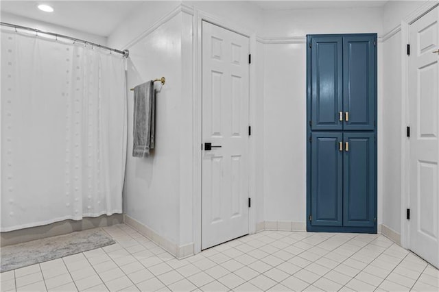 137 Oakton S, Eatonton, GA 31024 - bathroom with baseboards, tile patterned floors, and recessed lighting