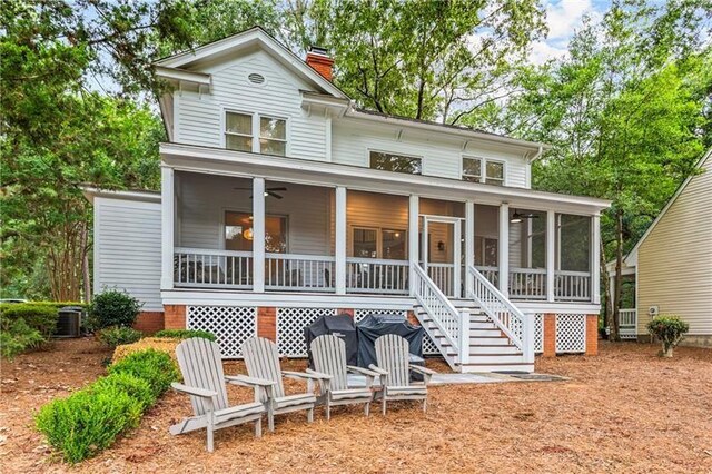 137 Oakton S, Eatonton, GA 31024 - view of front of property with stairway, a ceiling fan, a chimney, central AC, and a sunroom