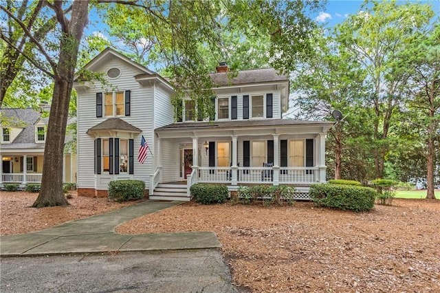 137 Oakton S, Eatonton, GA 31024 - view of front facade with a porch and a chimney