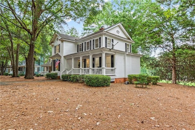 137 Oakton S, Eatonton, GA 31024 - rear view of house with a chimney and a porch