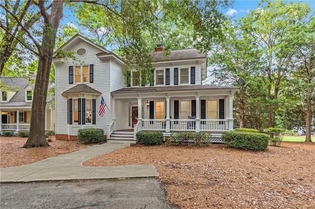 137 Oakton S, Eatonton, GA 31024 - view of front of house with a chimney and a porch