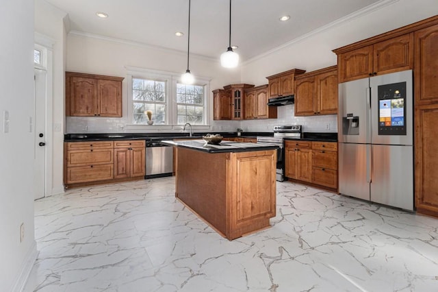 kitchen with dark countertops, brown cabinetry, marble finish floor, and appliances with stainless steel finishes