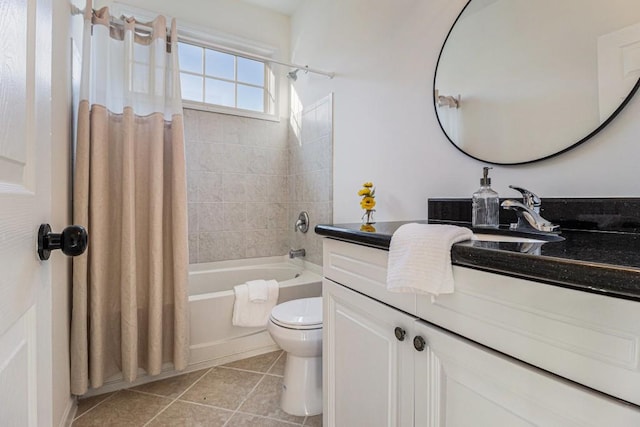 full bathroom featuring toilet, shower / bath combo, vanity, and tile patterned flooring