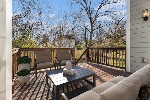 wooden deck featuring an outdoor hangout area