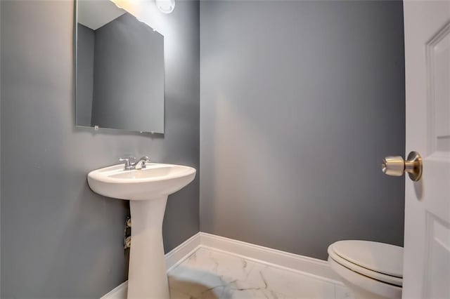 6269 Colonial Vw, Fairburn, GA 30213 - bathroom with marble look tile flooring, baseboards, and toilet