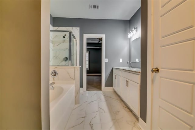 6269 Colonial Vw, Fairburn, GA 30213 - bathroom with a marble finish shower, marble finish floors, vanity, a bath, and baseboards
