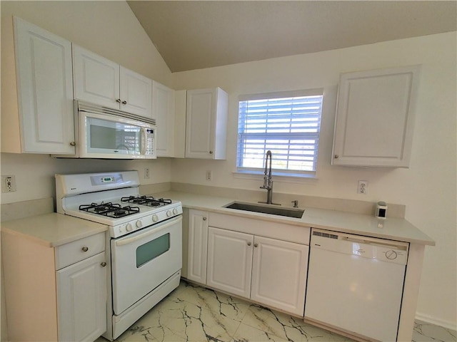 kitchen with sink, white cabinets, and white appliances