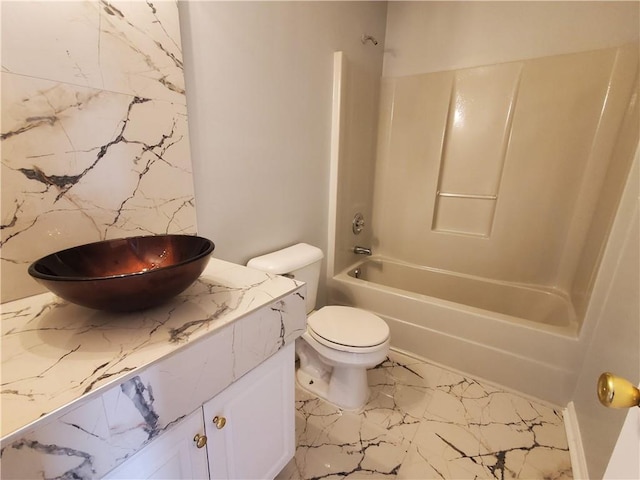 full bathroom with washtub / shower combination, vanity, and toilet