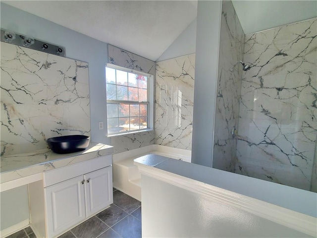 bathroom with tile patterned floors, vanity, separate shower and tub, and lofted ceiling