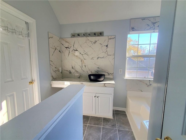 bathroom with a bath and vanity