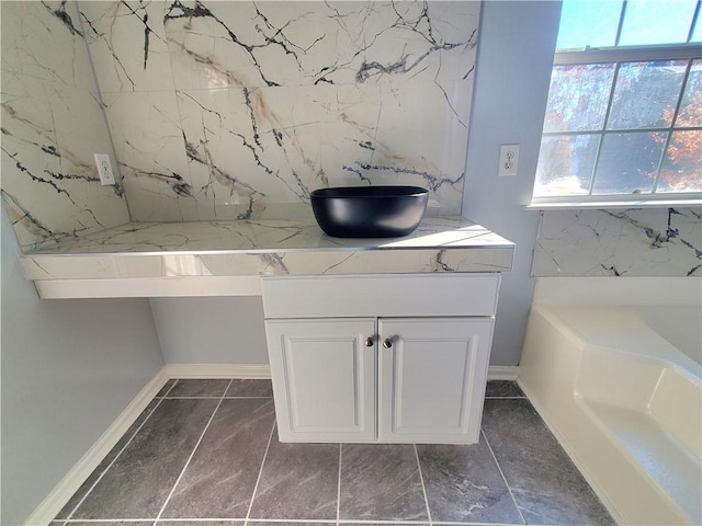 bathroom featuring a bath and vanity